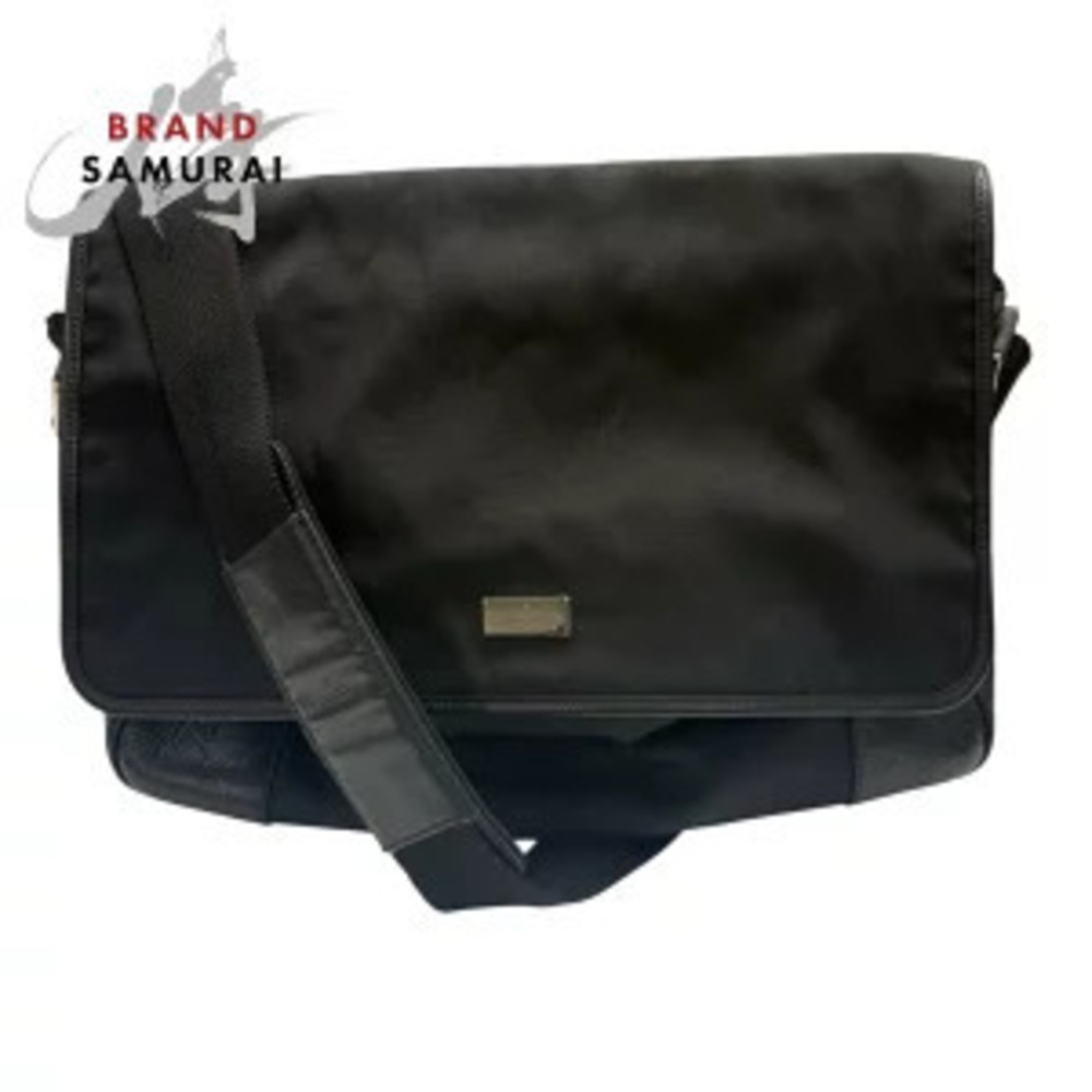 Gucci GG embossed black leather shoulder bag